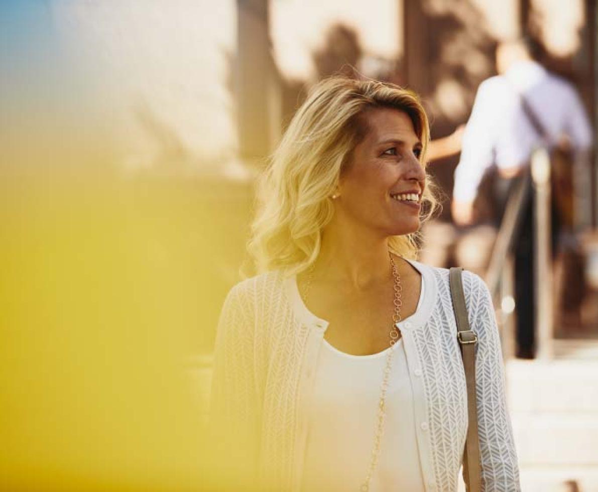 woman smiling and walking