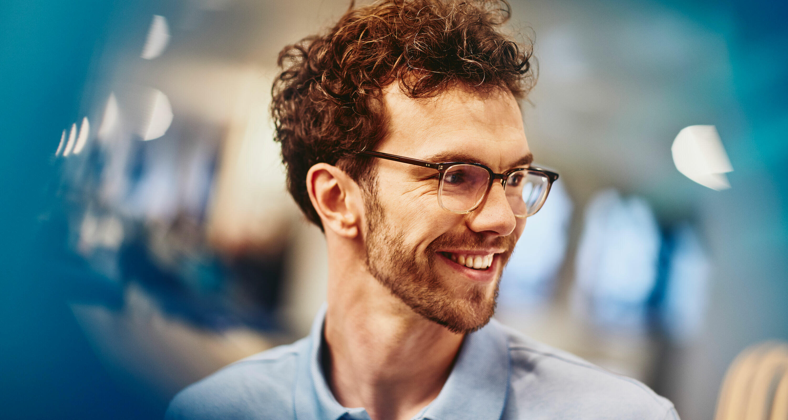 man with glasses smiling