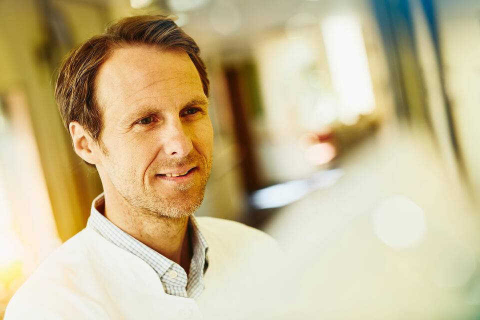 A man in a labcoat